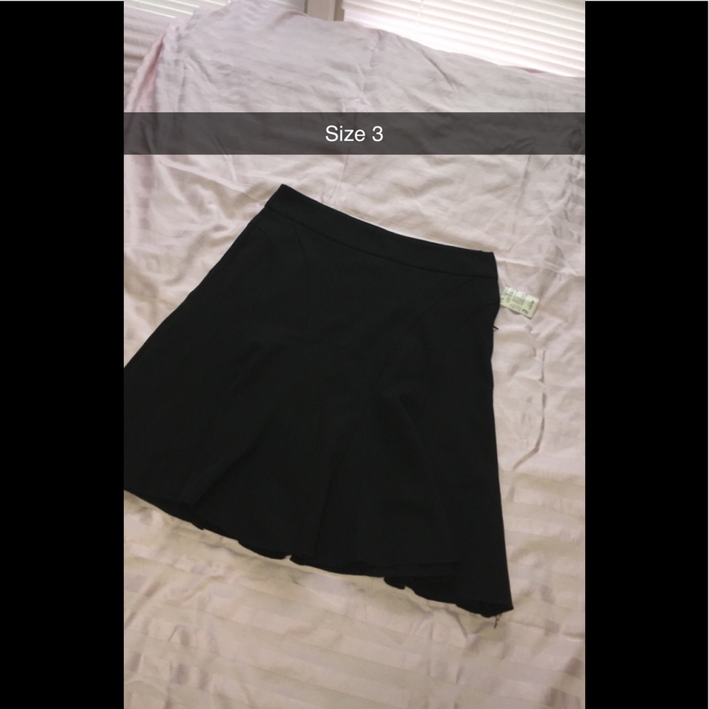 Black skirt above the knee flare